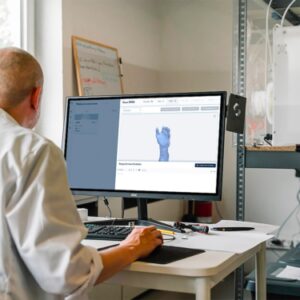 man in white dress shirt sitting in front of computer
